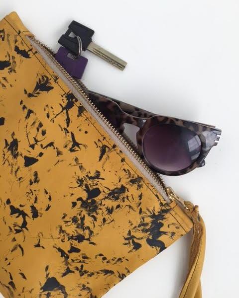 Stains yellow clutch bag